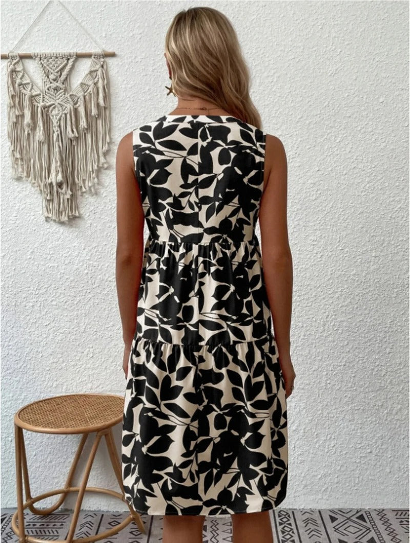 Women's boho floral short dress with a V neckline and fine straps in black, blue, green and orange