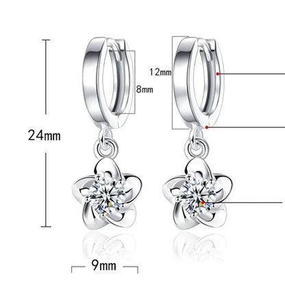 Kessoro women's round white zircon earrings shown in violet and silver tone finishes