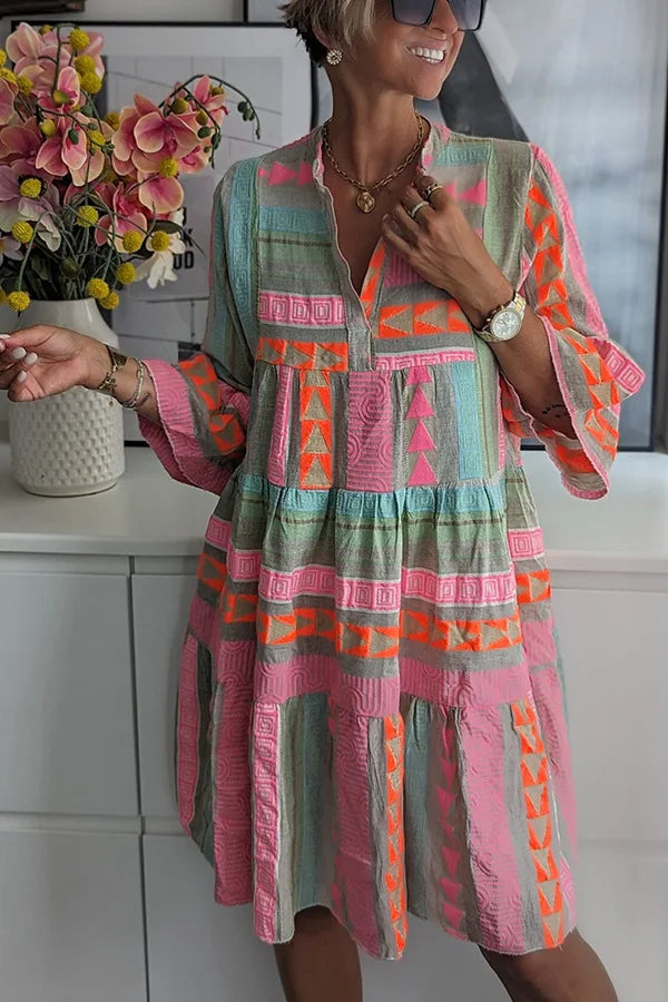Women's printed flowing swing midi dress with an expressive all-over pattern