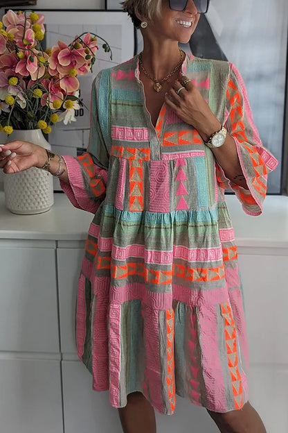 Women's printed flowing swing midi dress with an expressive all-over pattern