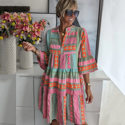 Women's printed flowing swing midi dress with an expressive all-over pattern