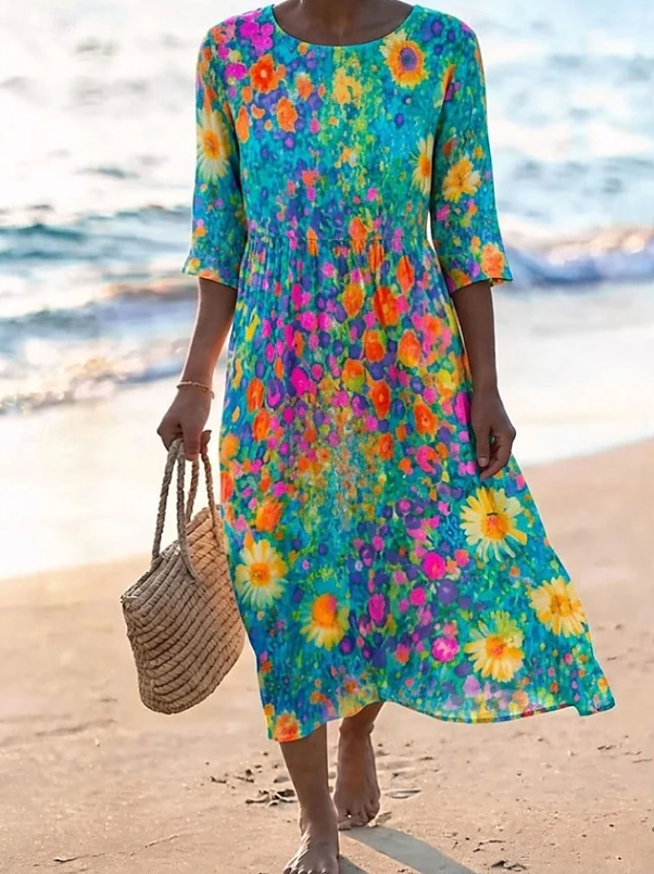 Women's flowing floral print midi dress in a light summer colourway