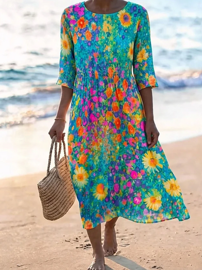 Women's flowing floral print midi dress in a light summer colourway