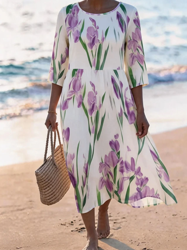 Women's flowing floral print midi dress in a light summer colourway