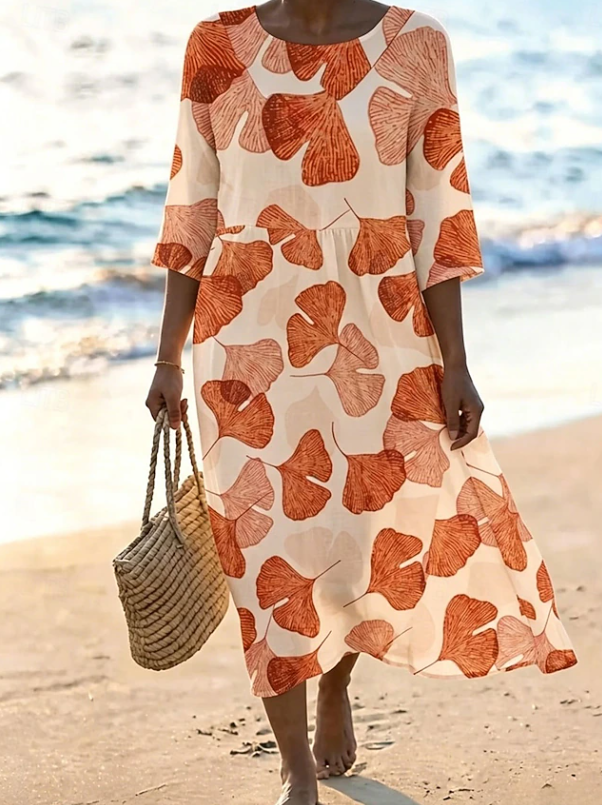Women's flowing floral print midi dress in a light summer colourway