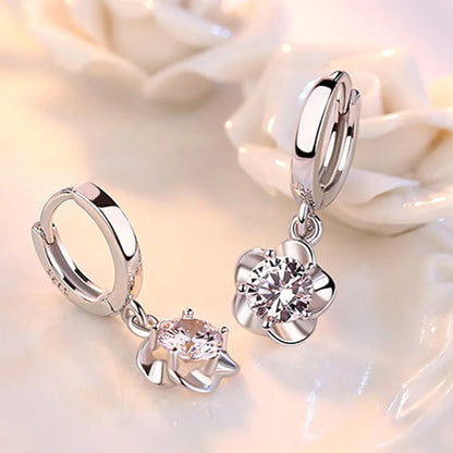 Kessoro women's round white zircon earrings shown in violet and silver tone finishes
