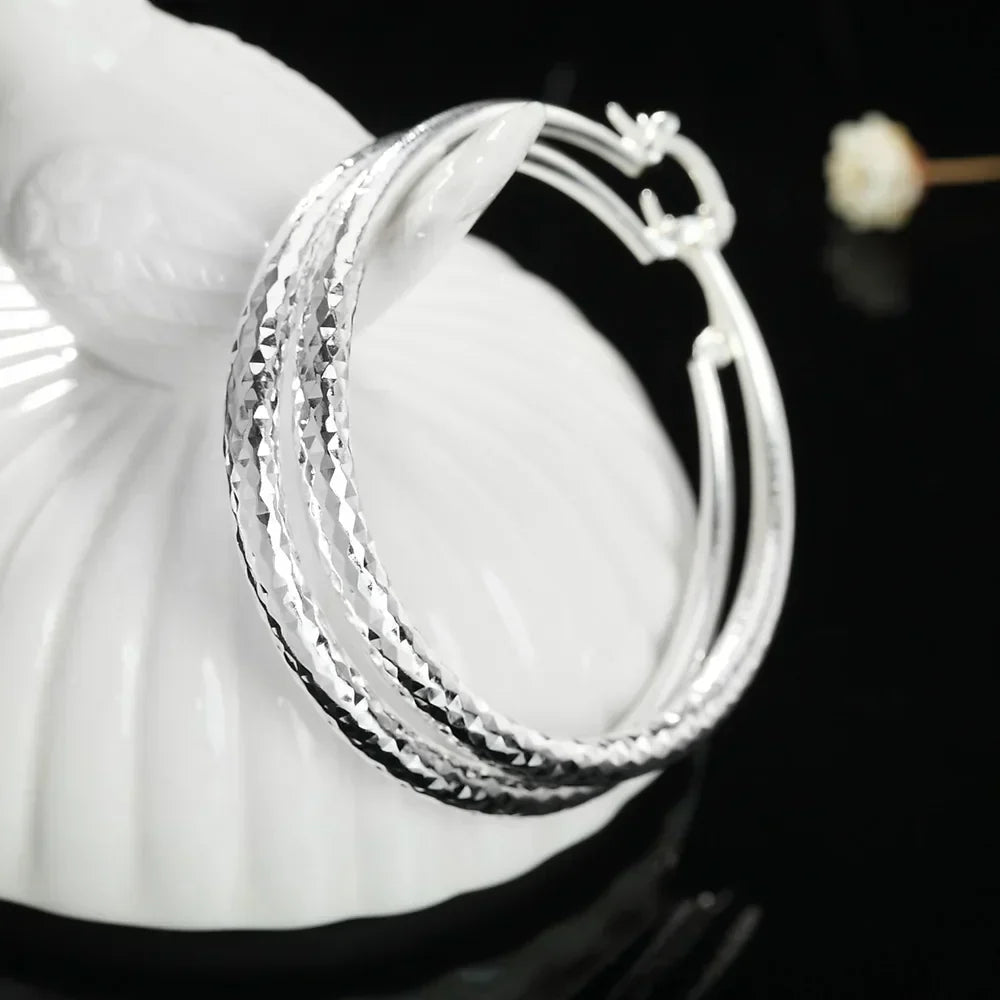 Kessoro women's retro silver tone long drop earrings with an elongated silhouette