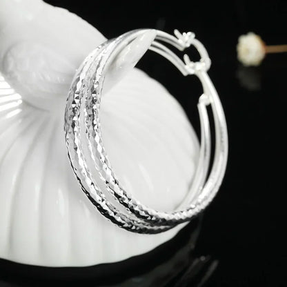 Kessoro women's retro silver tone long drop earrings with an elongated silhouette