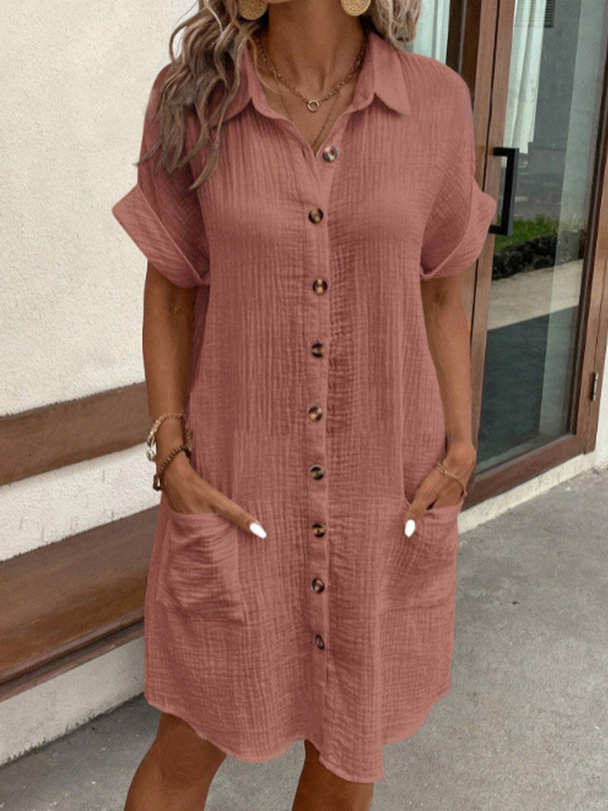 Women's relaxed polo dress with a collar, button front and pockets in white, black, yellow and green