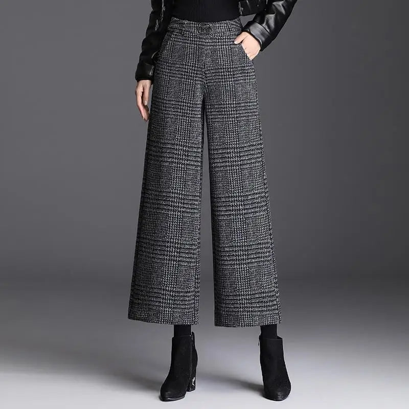Kessoro Women's Checked High-Waist Wide-Leg Trousers in plaid black, solid black and houndstooth gray — detail of the fabric and finish
