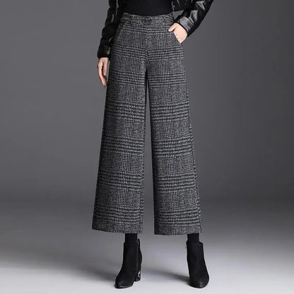 Kessoro Women's Checked High-Waist Wide-Leg Trousers in plaid black, solid black and houndstooth gray — detail of the fabric and finish