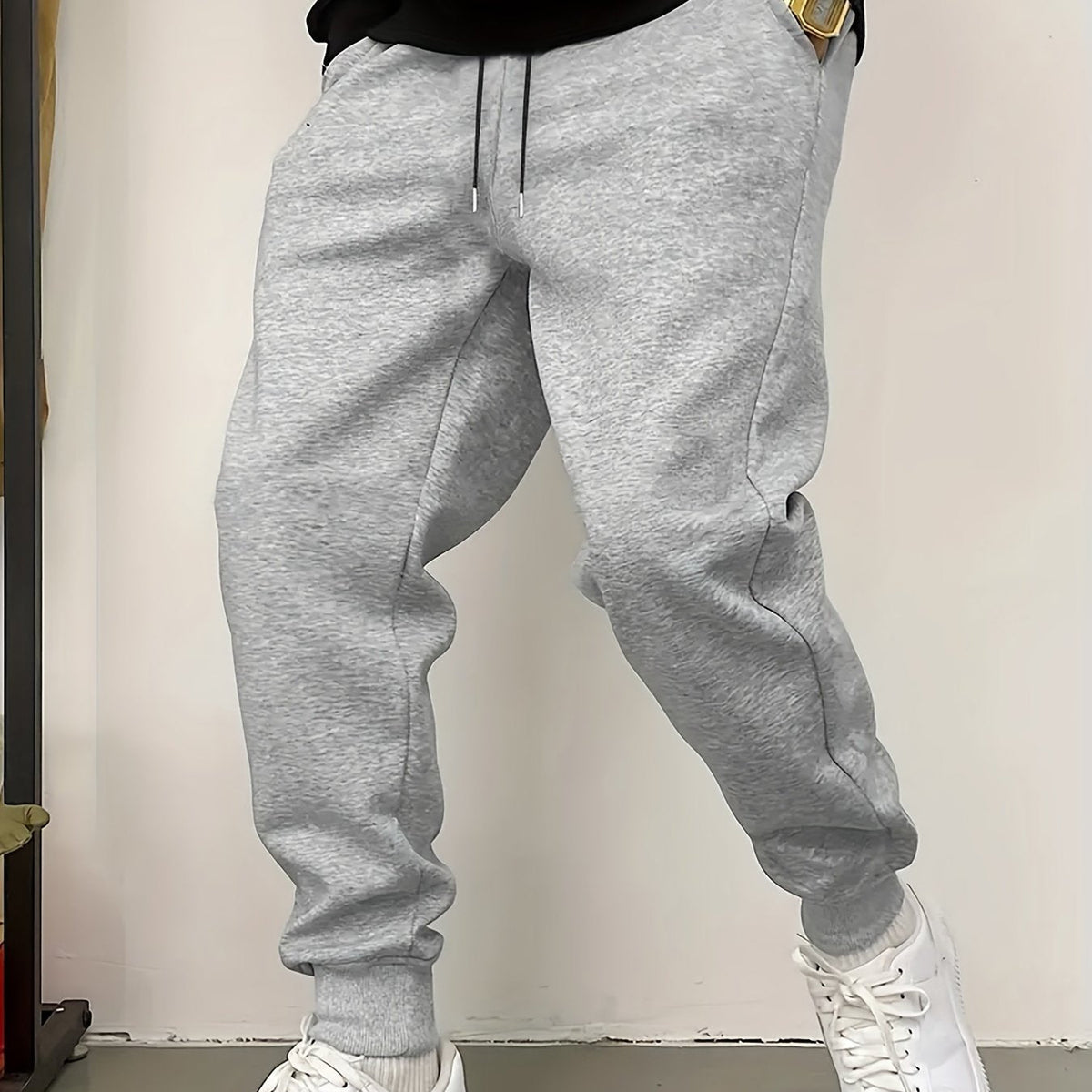 Kessoro unisex relaxed tapered drawstring joggers in black or grey with side pockets