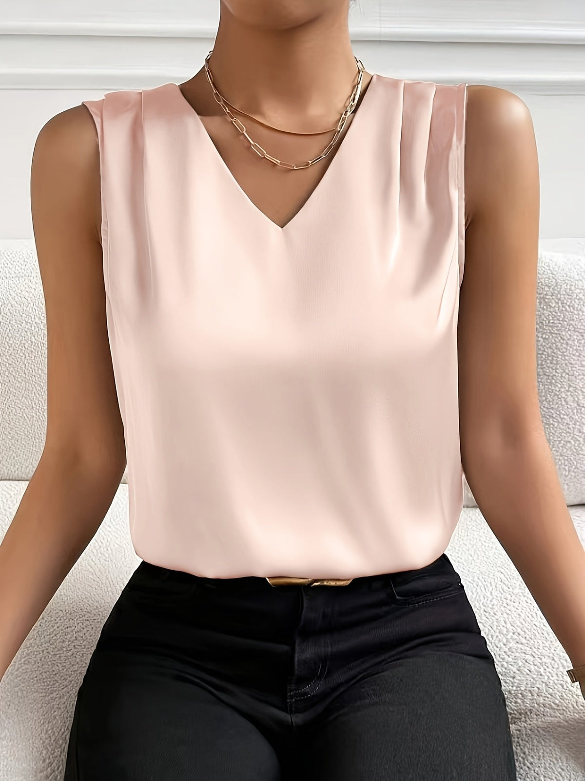 Women's sleeveless draped V-neck blouse in a refined solid colourway