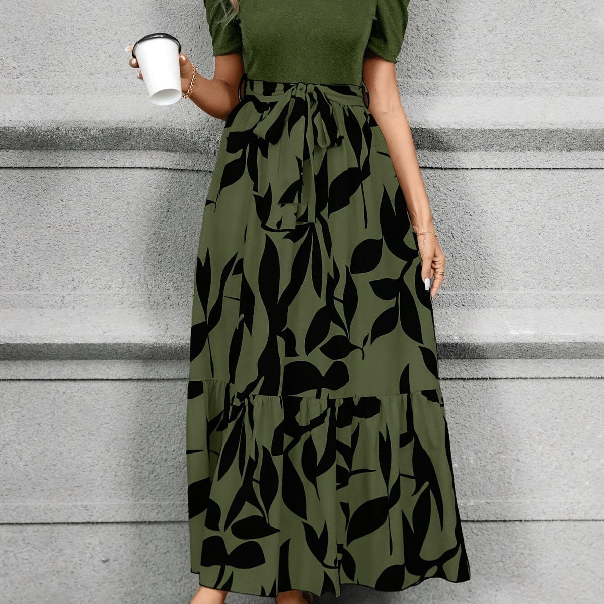 Kessoro women's printed tiered maxi dress shown in a green and black colourway on a female model