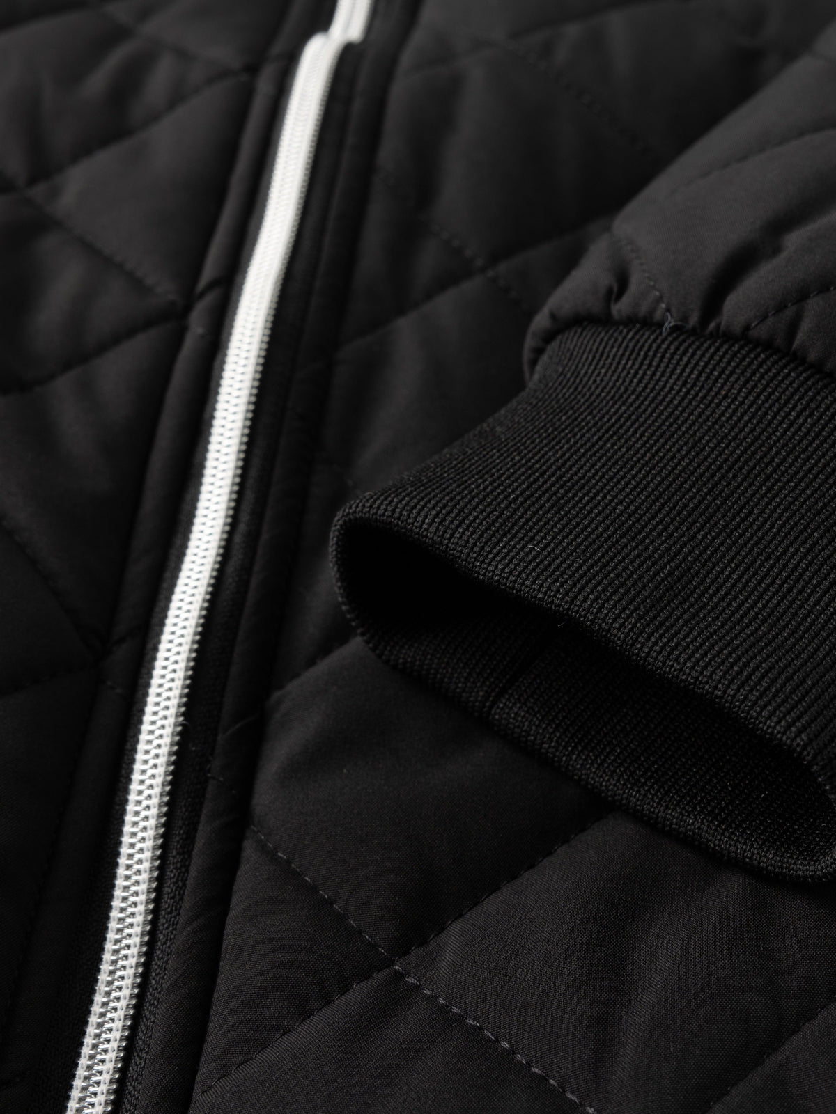 Kessoro unisex quilted bomber jacket in black with a full-length zip