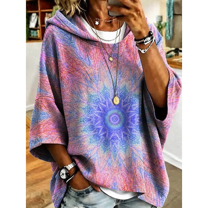 Women's floral print relaxed pullover hoodie in fuchsia, orange, blue and light purple, back view