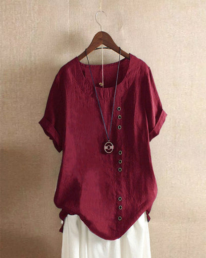 Women's asymmetrical button detail lightweight summer blouse in nine colourways, shown for womenswear styling