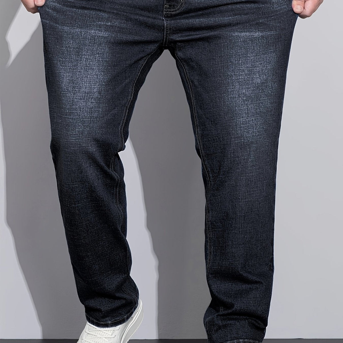 Men's mid-rise straight-leg stretch jeans in blue and black denim, colour option 1 styled view