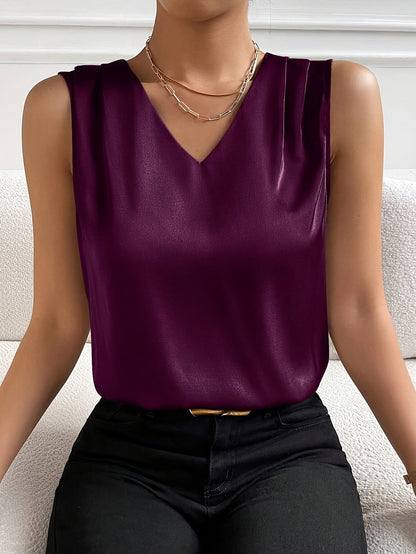 Women's sleeveless draped V-neck blouse in a refined solid colourway