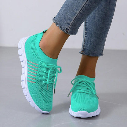 Kessoro Women's Lightweight Cushioned Everyday Sneakers in turquoise, pink, red and other colourways — worn with a full outfit