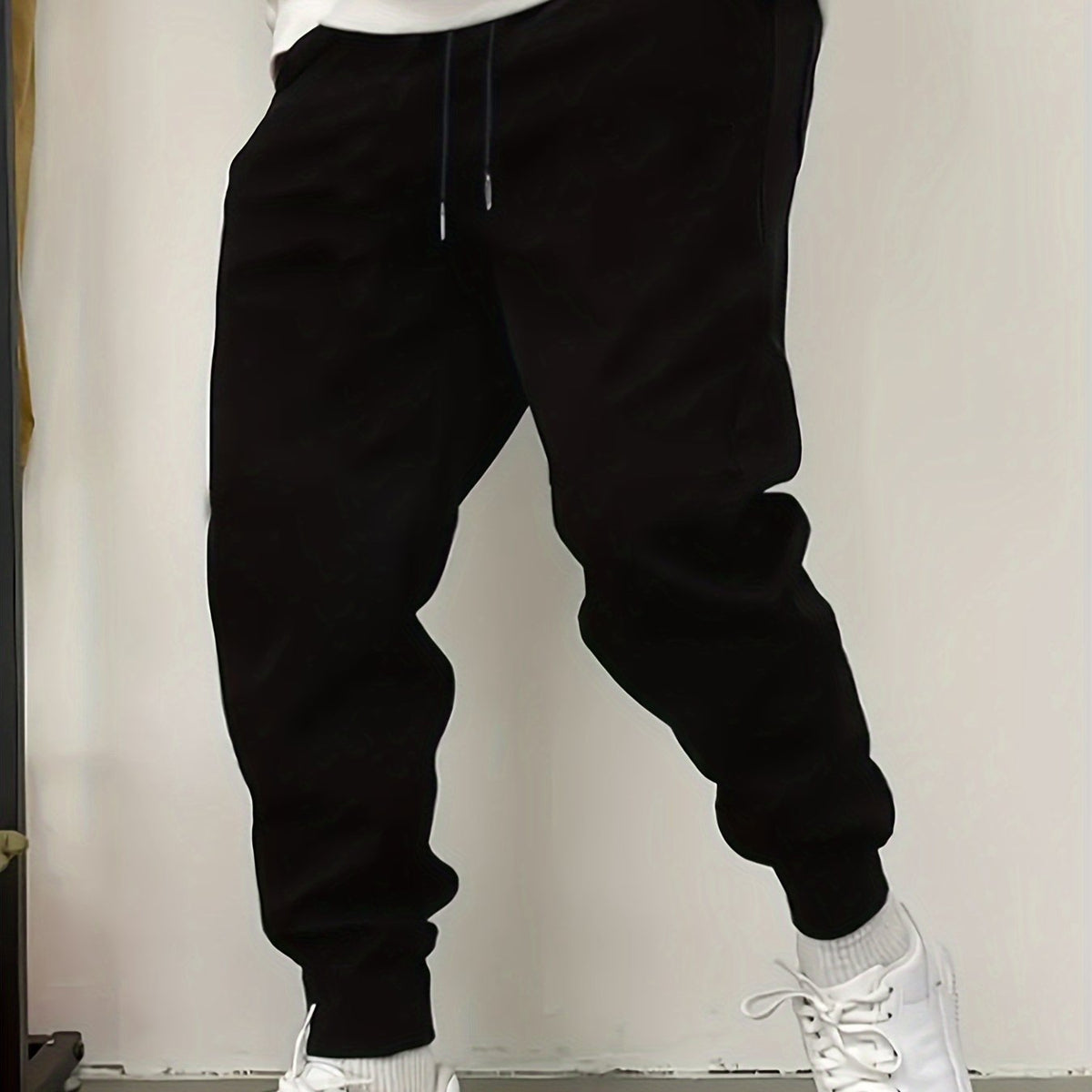 Kessoro unisex relaxed tapered drawstring joggers in black or grey with side pockets
