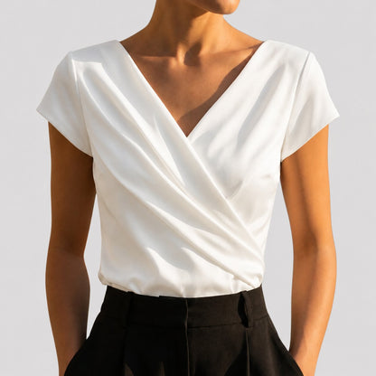 Women's draped wrap-front blouse in white and khaki with a V-neckline, front view