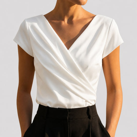 Women's draped wrap-front blouse in white and khaki with a V-neckline, front view