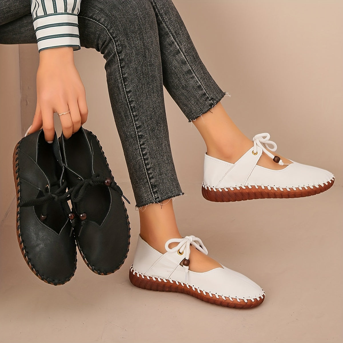 Kessoro Women's handcrafted cushioned lace-up flats in white and black, view 3