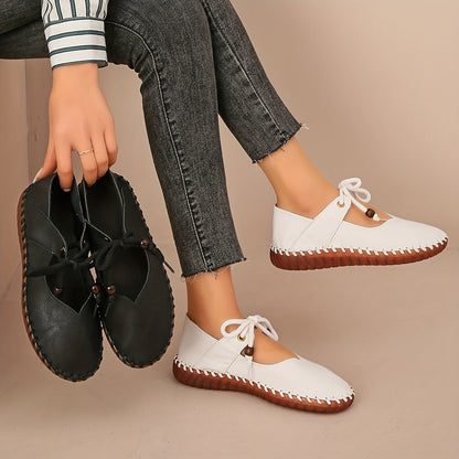 Kessoro Women's handcrafted cushioned lace-up flats in white and black, view 3