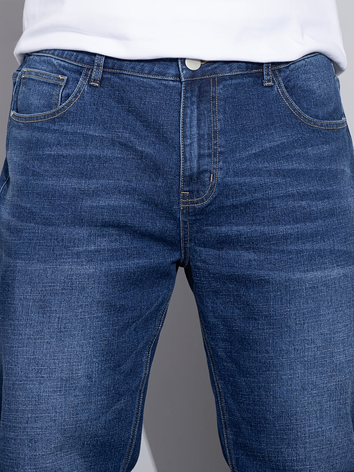 Men's mid-rise straight-leg stretch jeans in blue and black denim, styled view