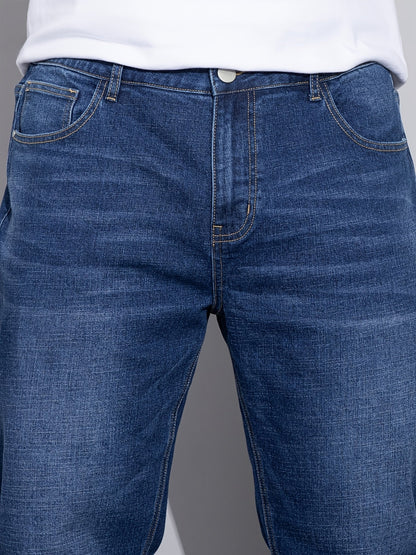 Men's mid-rise straight-leg stretch jeans in blue and black denim, styled view