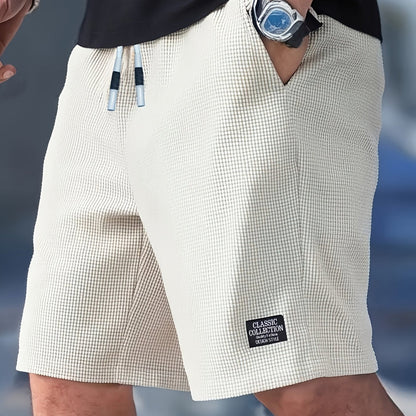 Kessoro Men's Textured Drawstring Relaxed Casual Shorts in black, khaki, beige and white — styled on model