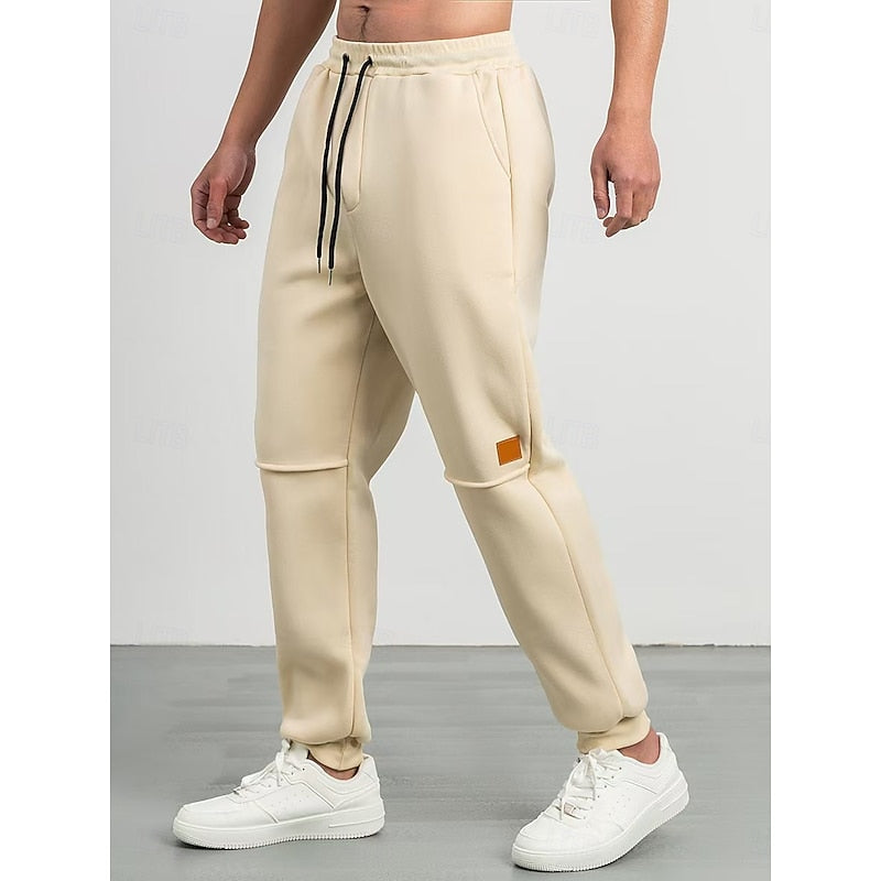 Kessoro unisex relaxed tapered drawstring joggers in apricot, green and blue