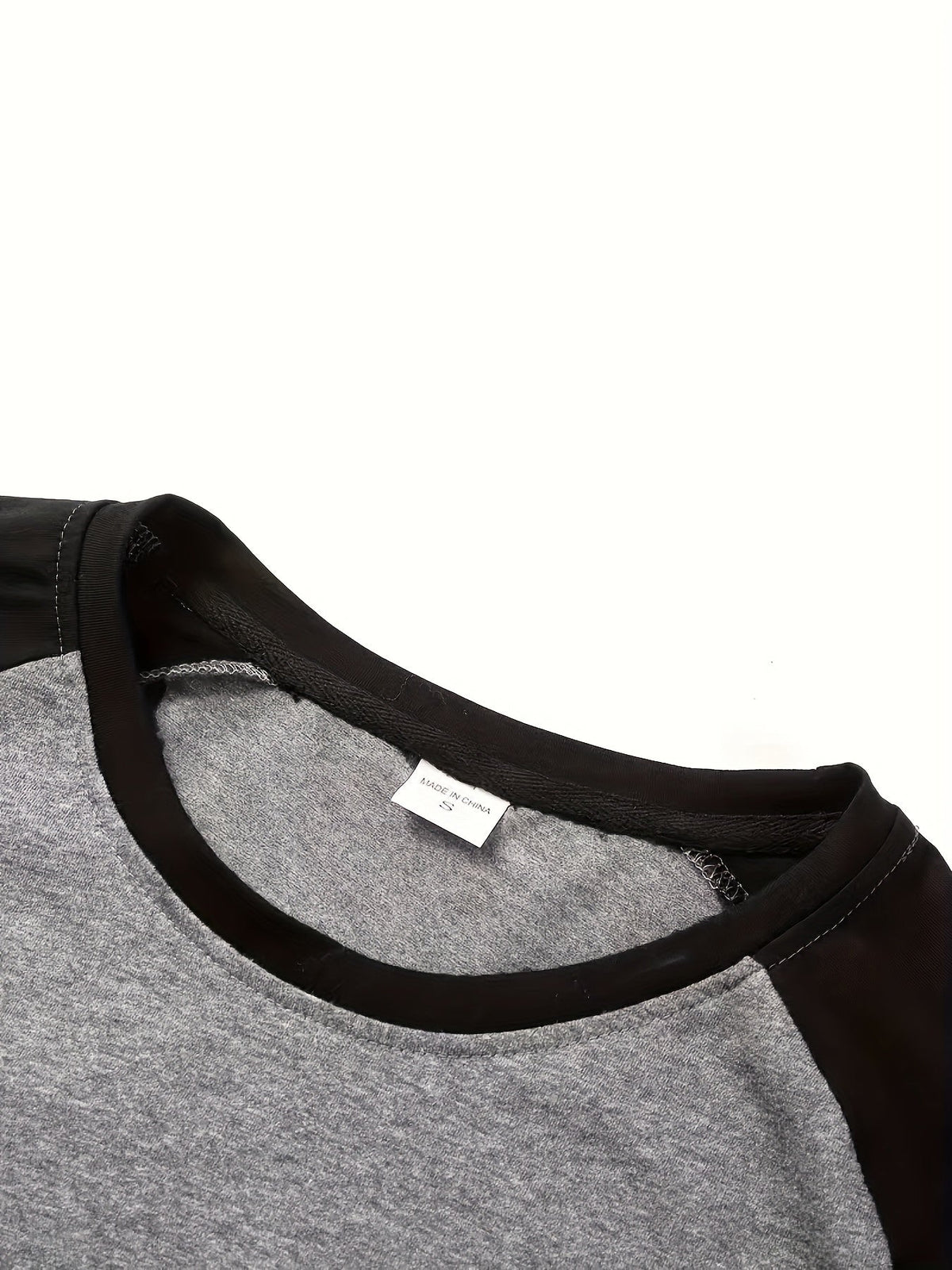 Men's two-tone raglan long-sleeve t-shirt in black, light grey and white, fabric texture view