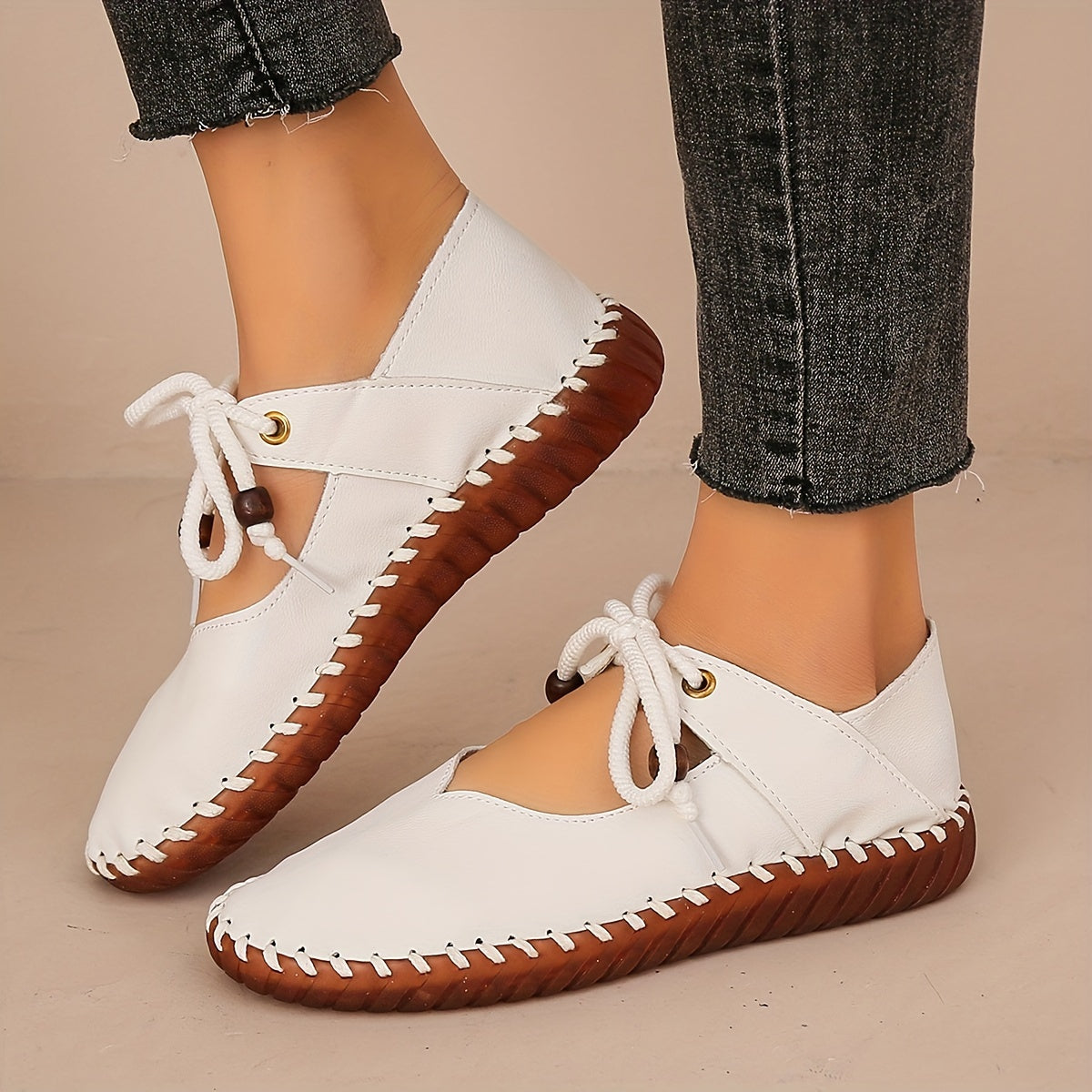 Kessoro Women's handcrafted cushioned lace-up flats in white and black, view 7