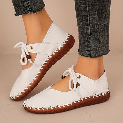 Kessoro Women's handcrafted cushioned lace-up flats in white and black, view 7