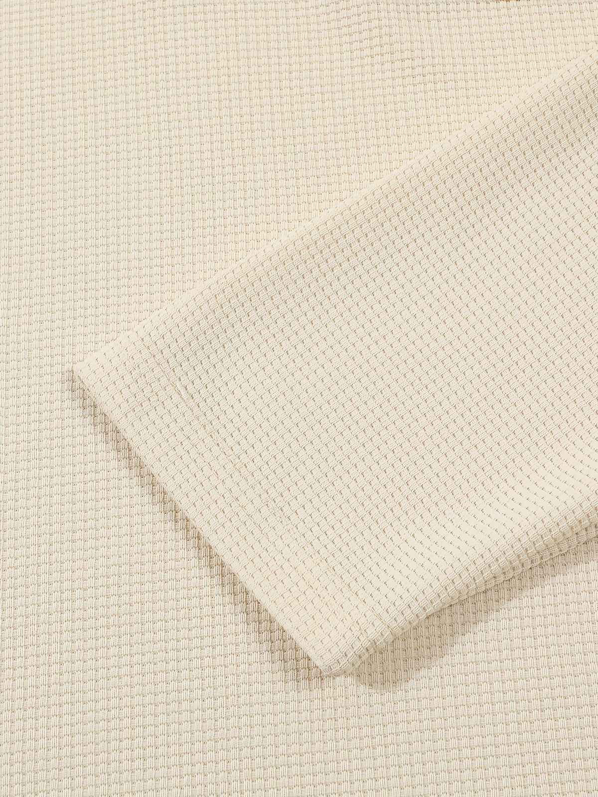 Men's textured long sleeve henley shirt in khaki, white, black, grey and burgundy, close-up view