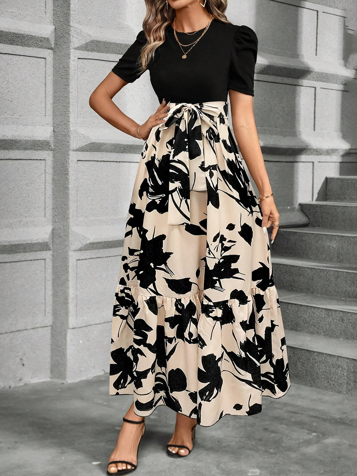 Kessoro women's printed tiered maxi dress shown in a green and black colourway on a female model