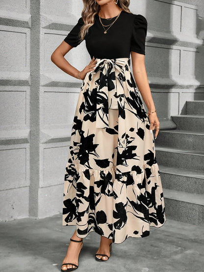 Kessoro women's printed tiered maxi dress shown in a green and black colourway on a female model