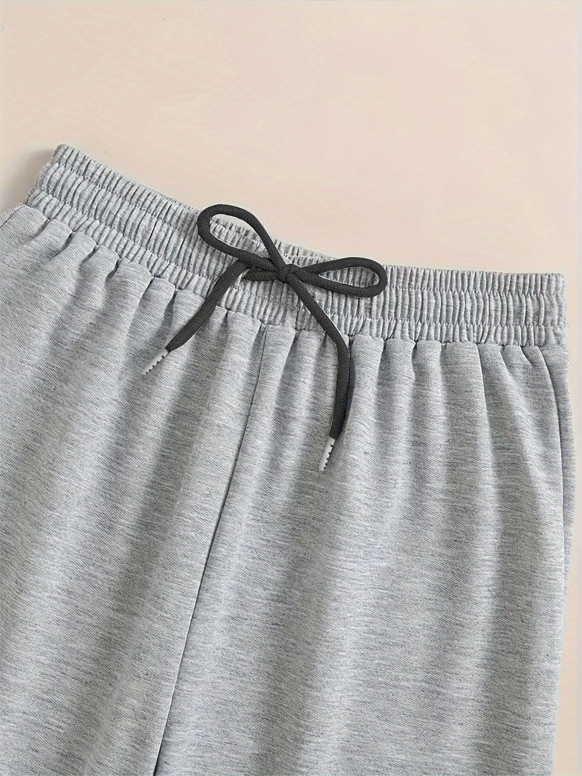 Kessoro unisex relaxed tapered drawstring joggers in black or grey with side pockets