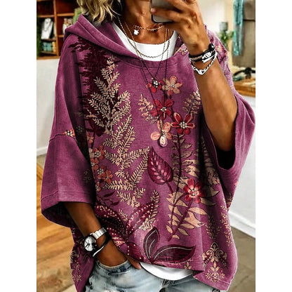 Women's floral print relaxed pullover hoodie in fuchsia, orange, blue and light purple, front view