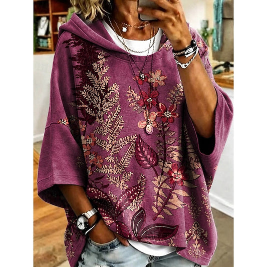 Women's floral print relaxed pullover hoodie in fuchsia, orange, blue and light purple, front view
