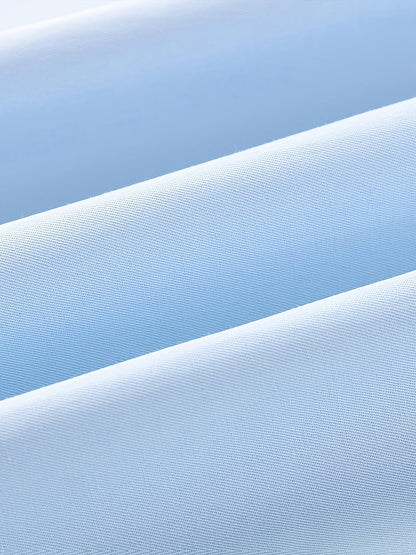 Men's tailored long-sleeve button-up shirt in sky blue, light grey and white, close-up view