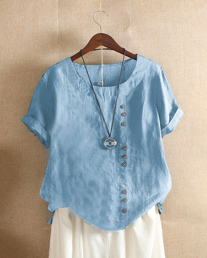 Women's asymmetrical button detail lightweight summer blouse in nine colourways, shown for womenswear styling