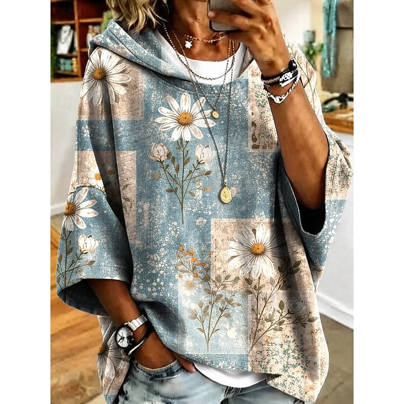 Women's floral print relaxed pullover hoodie in fuchsia, orange, blue and light purple, detail view