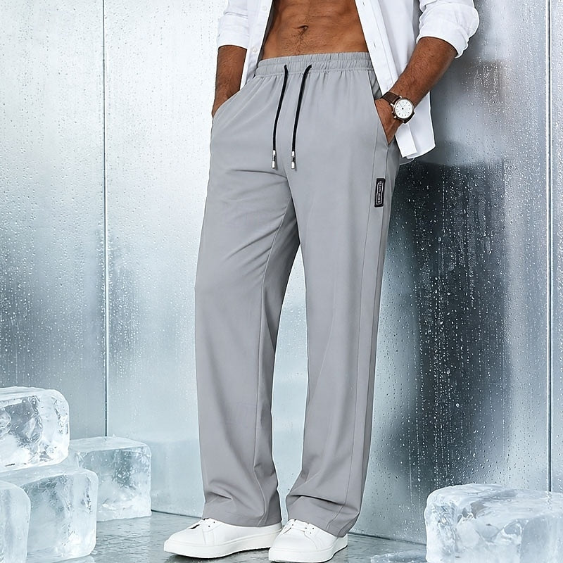 Men's relaxed straight-leg drawstring pants in light grey, black and navy, front view