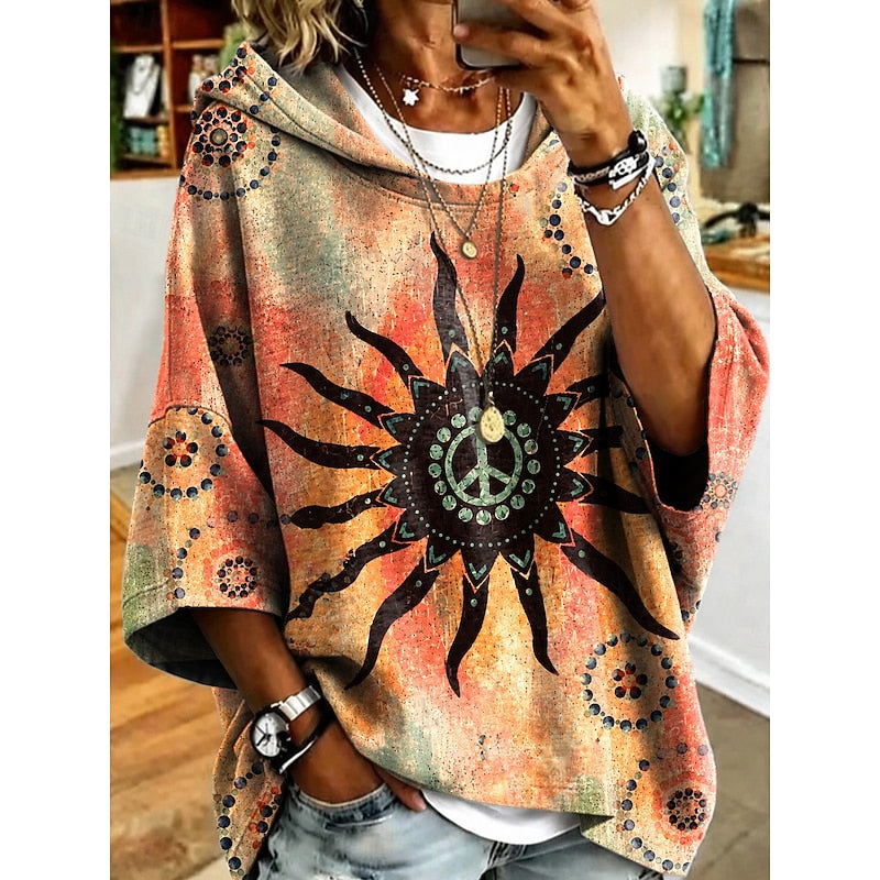Women's floral print relaxed pullover hoodie in fuchsia, orange, blue and light purple, side view