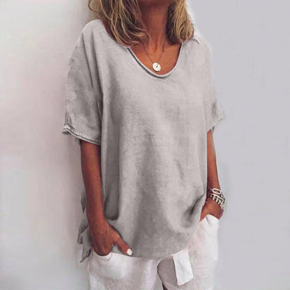 Women's draped V-neck short sleeve blouse in grey, white, pink, sea blue and green, shown for womenswear styling
