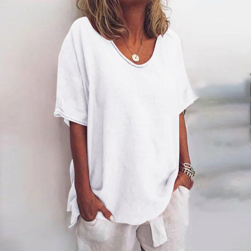 Women's draped V-neck short sleeve blouse in grey, white, pink, sea blue and green, shown for womenswear styling