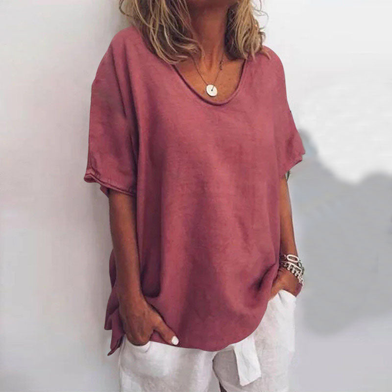 Women's draped V-neck short sleeve blouse in grey, white, pink, sea blue and green, shown for womenswear styling